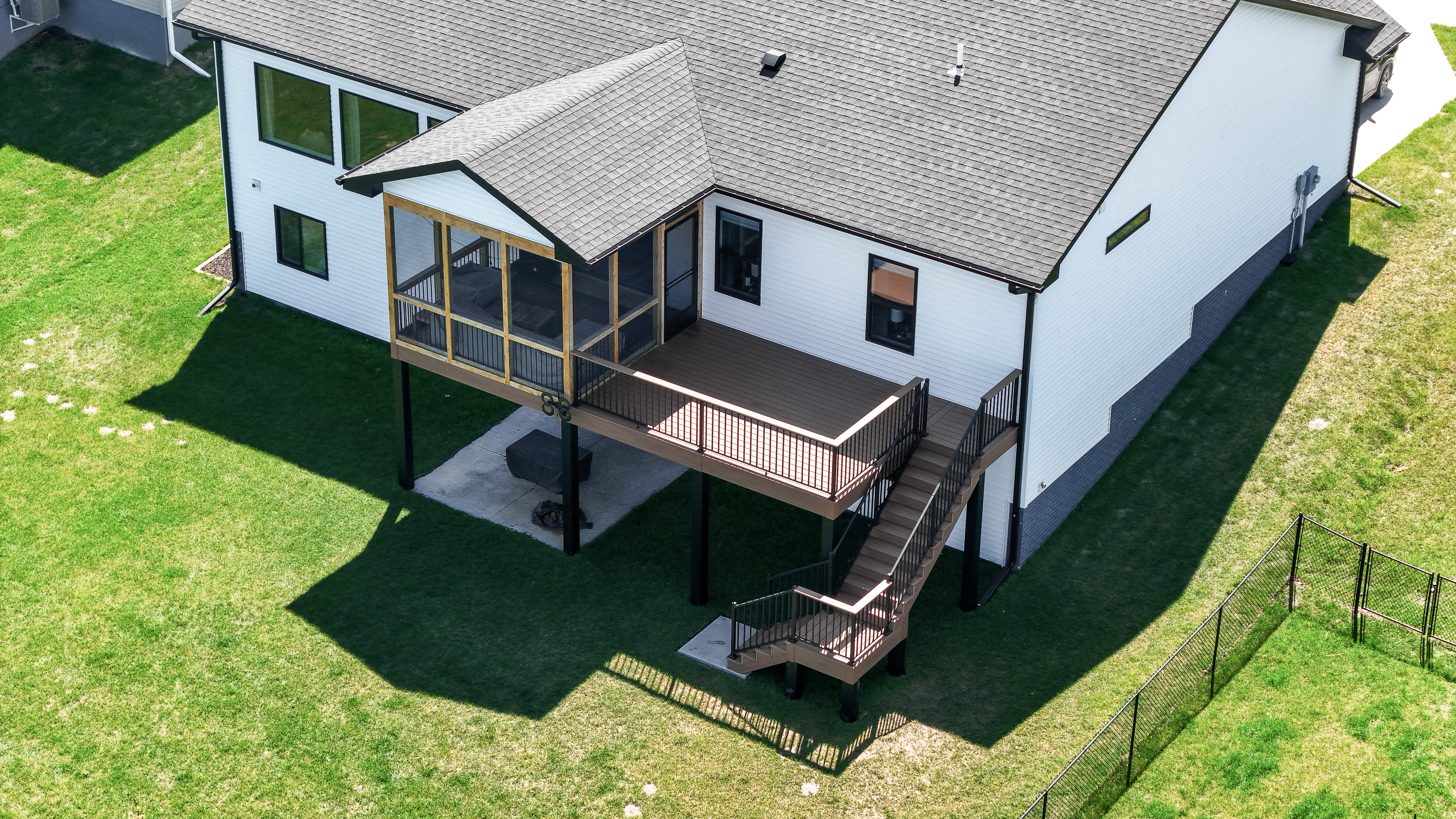 Elevated composite deck and screen room aerial view in Tiffin Iowa